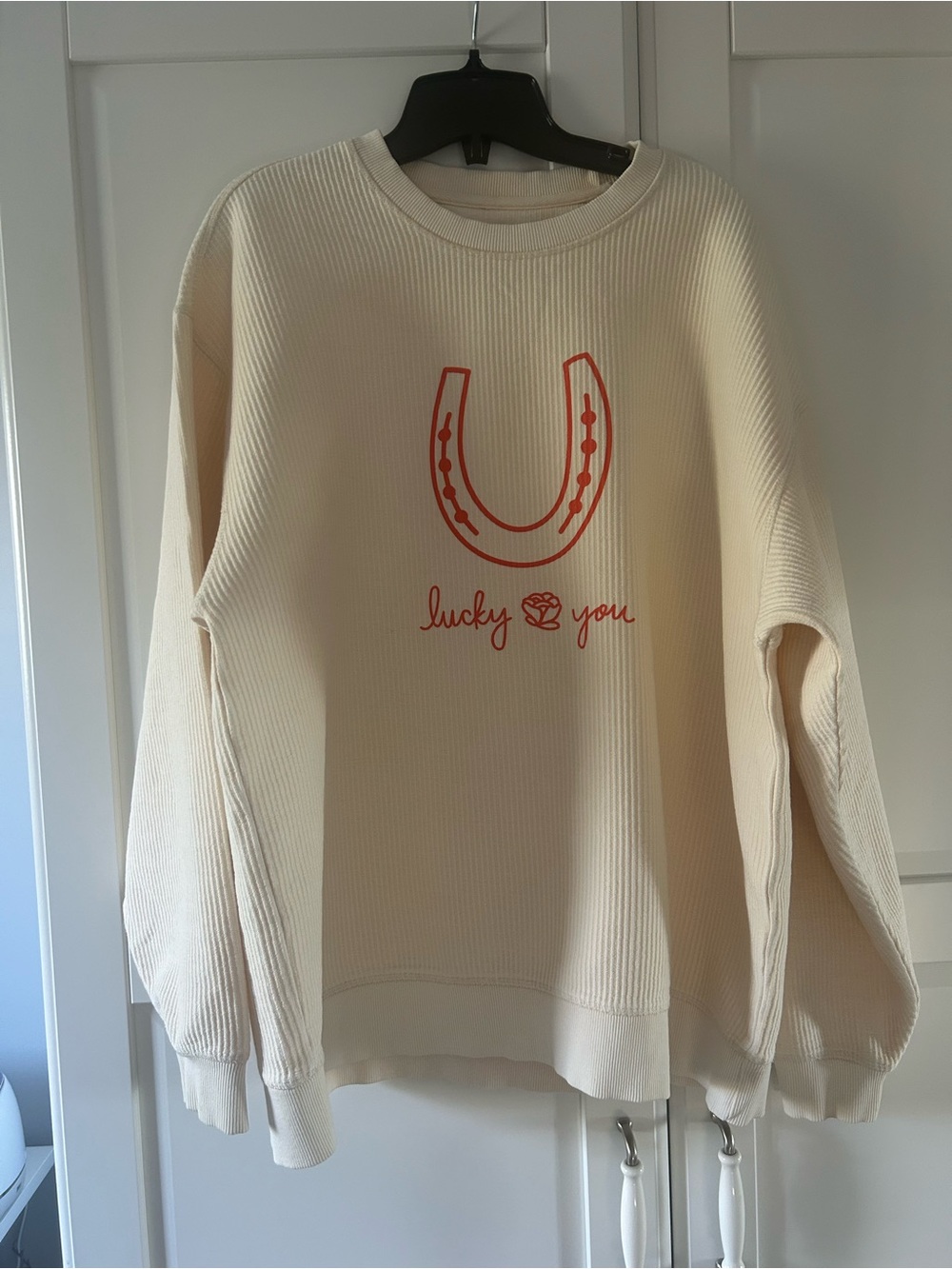 Cream Corded Crew Sweater with Red Horseshoe Graphic